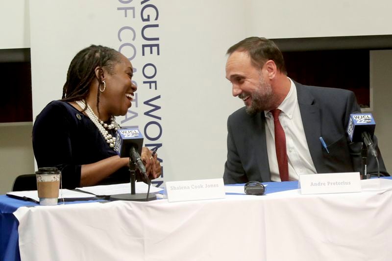 District Attorney Shalena Cook Jones, left, shares a laugh with Republican challenger Andre Pretorius following the League of Women Voters of Coastal Georgia candidate forum on Monday, Sept. 16, 2024, at the Coastal Georgia Center in Savannah, Ga. (Richard Burkhart/Savannah Morning News via AP)