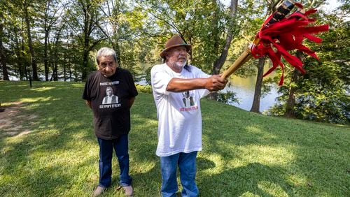 Robyn Soweka Sr., of Hickory Ground Tribal Town, right, describes a tribal challenge issued to the Poarch Band, Tuesday, Sept. 24, 2024, in Wetumoka, Ala. At left is George Thompson, who is the Mekko, a ceremonial leader, of Hickory Ground in the Muscogee Nation. (AP Photo/Vasha Hunt)