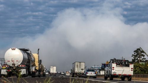 The smoke cloud from a chemical plant fire drifts across I-20 in Conyers Thursday morning. John Spink/ AJC