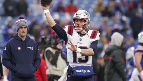 New England Patriots quarterback Nathan Rourke (13) warms up before an NFL football game, Sunday, Dec. 31, 2023, in Orchard Park, NY. (AP Photo/Matt Durisko)