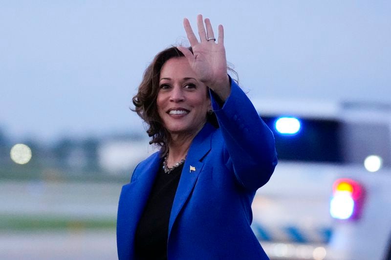 Democratic presidential nominee Vice President Kamala Harris waving during her arrival at O'Hare International Airport in Chicago on Sunday, Aug. 18, 2024. (AP Photo/Brynn Anderson)