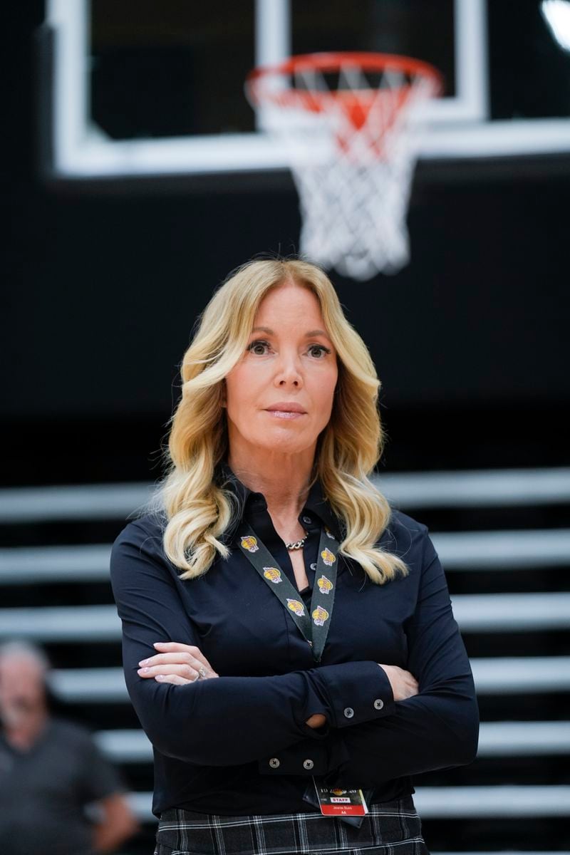 Los Angeles Lakers owner Jeanie Buss listens to JJ Redick speak after Redick was introduced as the NBA basketball team's new head coach Monday, June 24, 2024, in El Segundo, Calif. (AP Photo/Damian Dovarganes)