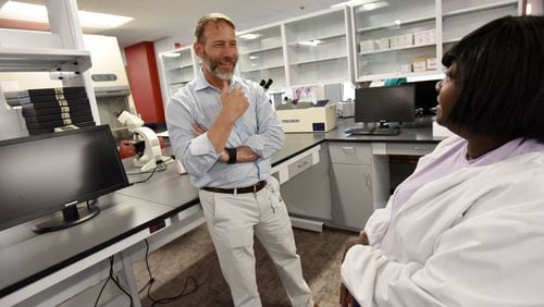 David Holland (left), Chief Clinical Officer, talks to Cassandra Marquette, Lab Director, in laboratory at new Fulton County Public Health Clinic on Tuesday, May 9, 2017. The newest Fulton County Health Center and district offices recently opened for patient and client services. Fulton Countyâ€™s former flagship Aldredge Clinic is now operating as Fulton County Public Health at 10 Park Place South SE. HYOSUB SHIN / HSHIN@AJC.COM