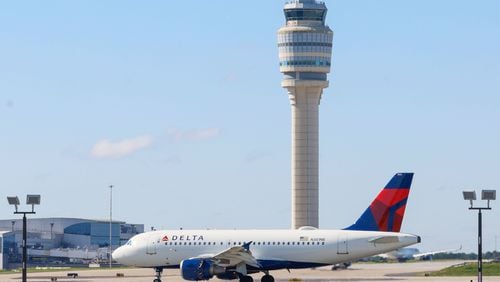 A Delta airplane is seen on the runaway at Hartsfield-Jackson Atlanta International Airport on Wednesday, May 22, 2024.
Miguel Martinez /miguel.martinezjimenez@ajc.com