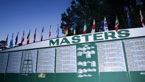 The Masters scoreboard on the first fairway is shown as the sun sets after the final round of the 2023 Masters Tournament at Augusta National Golf Club, Sunday, April 9, 2023, in Augusta, Ga. Jason Getz / Jason.Getz@ajc.com)