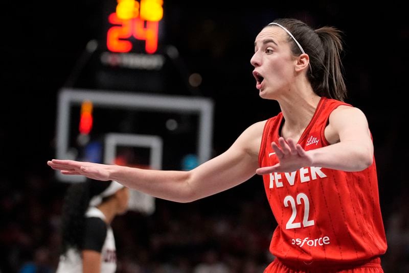 Indiana Fever's Caitlin Clark (22) gestures towards the bench in the second half of an WNBA basketball game against the Atlanta Dream, Monday, Aug. 26, 2024, in Atlanta. (AP Photo/Brynn Anderson)