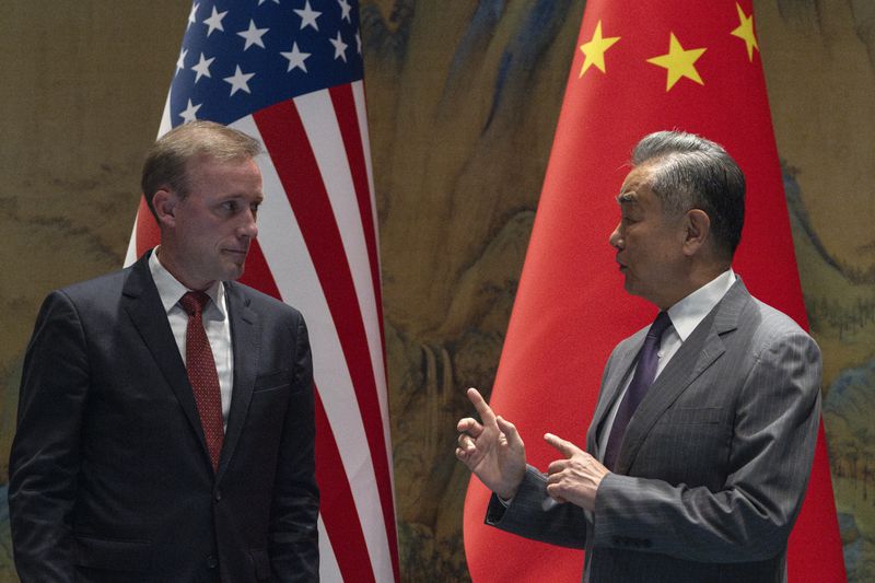 Wang Yi, right, the director of the Communist Party's Central Foreign Affairs Commission Office speaks to White House national security adviser Jake Sullivan, left, before their talk at Yanqi lake in Beijing, Tuesday, Aug. 27, 2024. (AP Photo/Ng Han Guan, Pool)