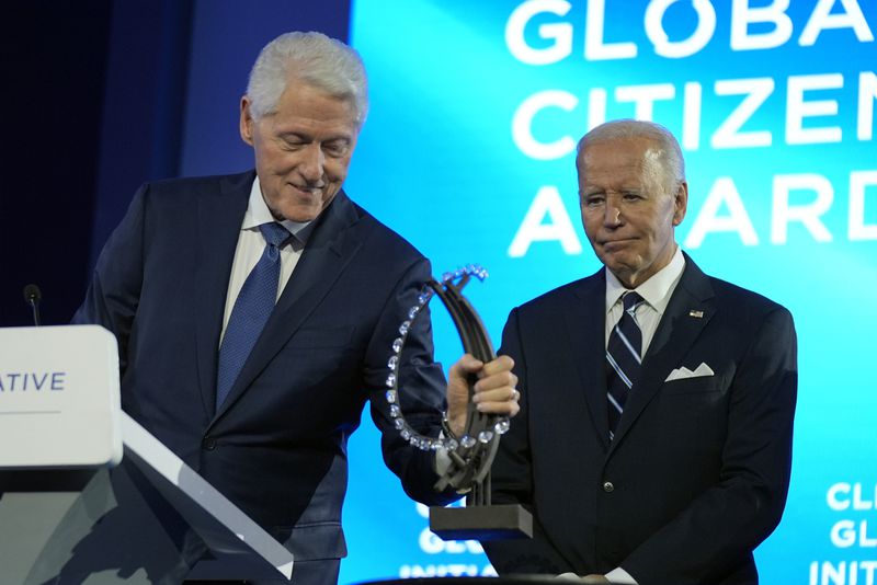 President Joe Biden is presented with the Global Citizen Award by former President Bill Clinton at the Clinton Global Initiative Monday, Sept. 23, 2024, in New York. (AP Photo/Manuel Balce Ceneta)