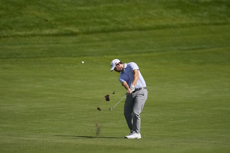 Patrick Cantlay hits on the fairway on the 17th hole during the second round of the BMW Championship golf event at Castle Pines Golf Club, Friday, Aug. 23, 2024, in Castle Rock, Colo. (AP Photo/Matt York)