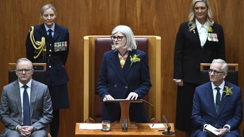 Governor-General of Australia Sam Mostyn, center, speaks during the swearing in ceremony in the Senate chamber at Parliament House in Canberra, Monday, July 1, 2024, as Prime Minister Anthony Albanese, left, listens. Mostyn is Australia's second woman governor-general, a largely ceremonial role representing the British monarch as the nation's head of state. (Lukas Coch/AAP Image via AP)