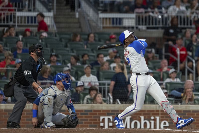 Atlanta Braves' Jorge Soler hits a double to center field in the fourth inning of a baseball game against the Kansas City Royals, Saturday, Sept. 28, 2024, in Atlanta. (AP Photo/Jason Allen)