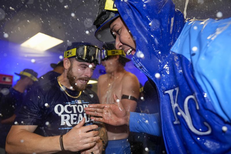 Kansas City Royals outfielder Kyle Isbel, left, and catcher Salvador Perez celebrate after defeating the Baltimore Orioles 2-1 in Game 2 of an AL Wild Card Series baseball game, Wednesday, Oct. 2, 2024 in Baltimore. (AP Photo/Stephanie Scarbrough)