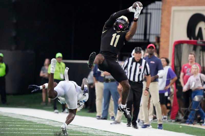 Wake Forest wide receiver Donavon Greene (11) pulls in a catch against Mississippi during the first half of an NCAA college football game in Winston-Salem, N.C., Saturday, Sept. 14, 2024. (AP Photo/Chuck Burton)