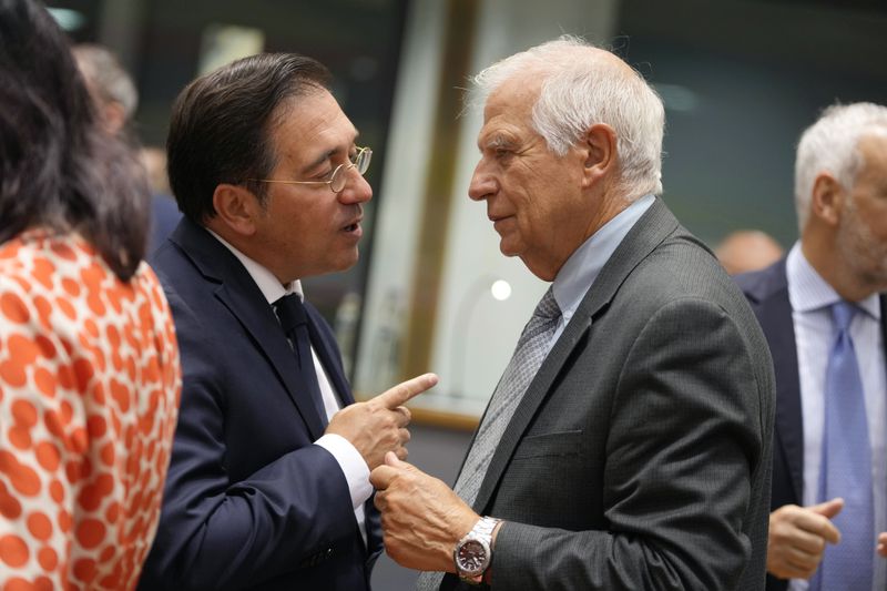 Spain's Foreign Minister Jose Manuel Albares Bueno, left, speaks with European Union foreign policy chief Josep Borrell during a meeting of EU foreign ministers at the European Council building in Brussels, Thursday, Aug. 29, 2024. (AP Photo/Virginia Mayo)