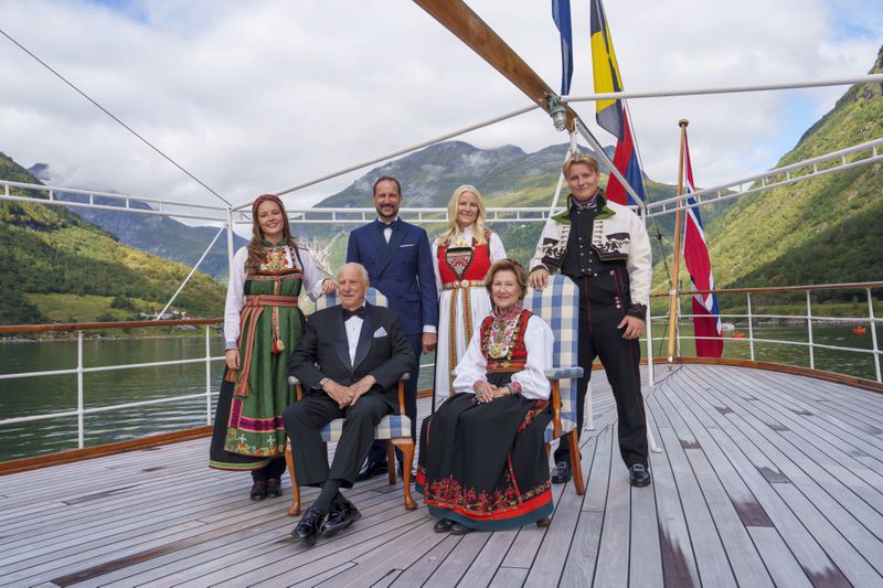 Norway's King Harald, Queen Sonja, front, Crown Prince Haakon, rear center left, Crown Princess Mette-Marit, rear center right, Princess Ingrid Alexandra and Prince Sverre Magnus aboard the Kingship Norway in the Geirangerfjord, Norway, Saturday Aug. 31, 2024, ahead of the wedding of Norway's Princess Martha Louise and Durek Verrett. (Cornelius Poppe/NTB via AP)