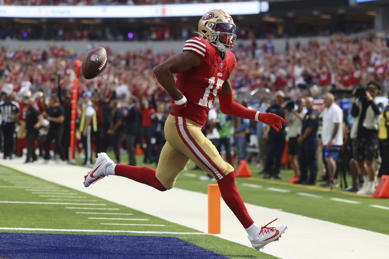 San Francisco 49ers wide receiver Jauan Jennings (15) reacts after scoring against the Los Angeles Rams during the second half of an NFL football game, Sunday, Sept. 22, 2024, in Inglewood, Calif. (AP Photo/Ryan Sun)