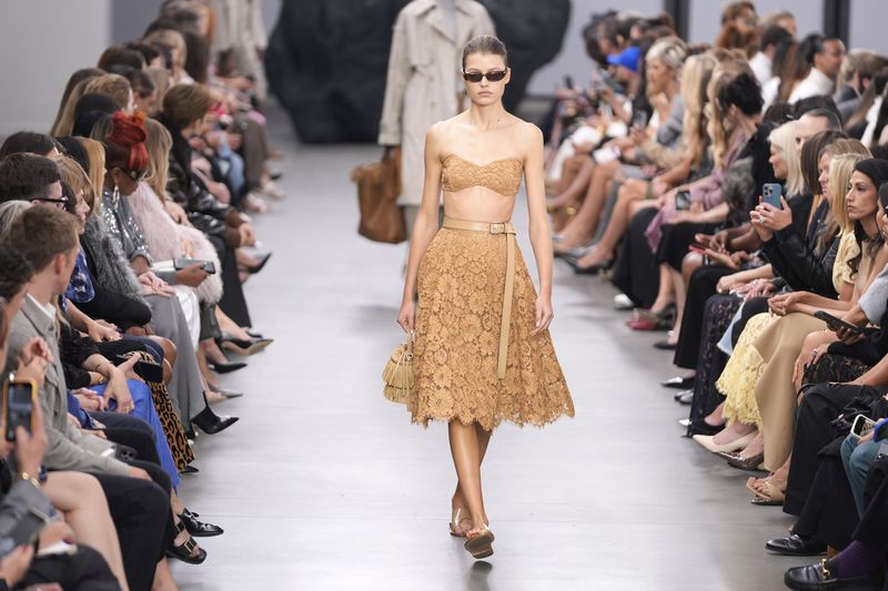 A model walks the runway during the Michael Kors Collection spring/summer 2025 fashion show as part of New York Fashion Week, Tuesday, Sept. 10, 2024, in New York. (AP Photo/Pamela Smith)