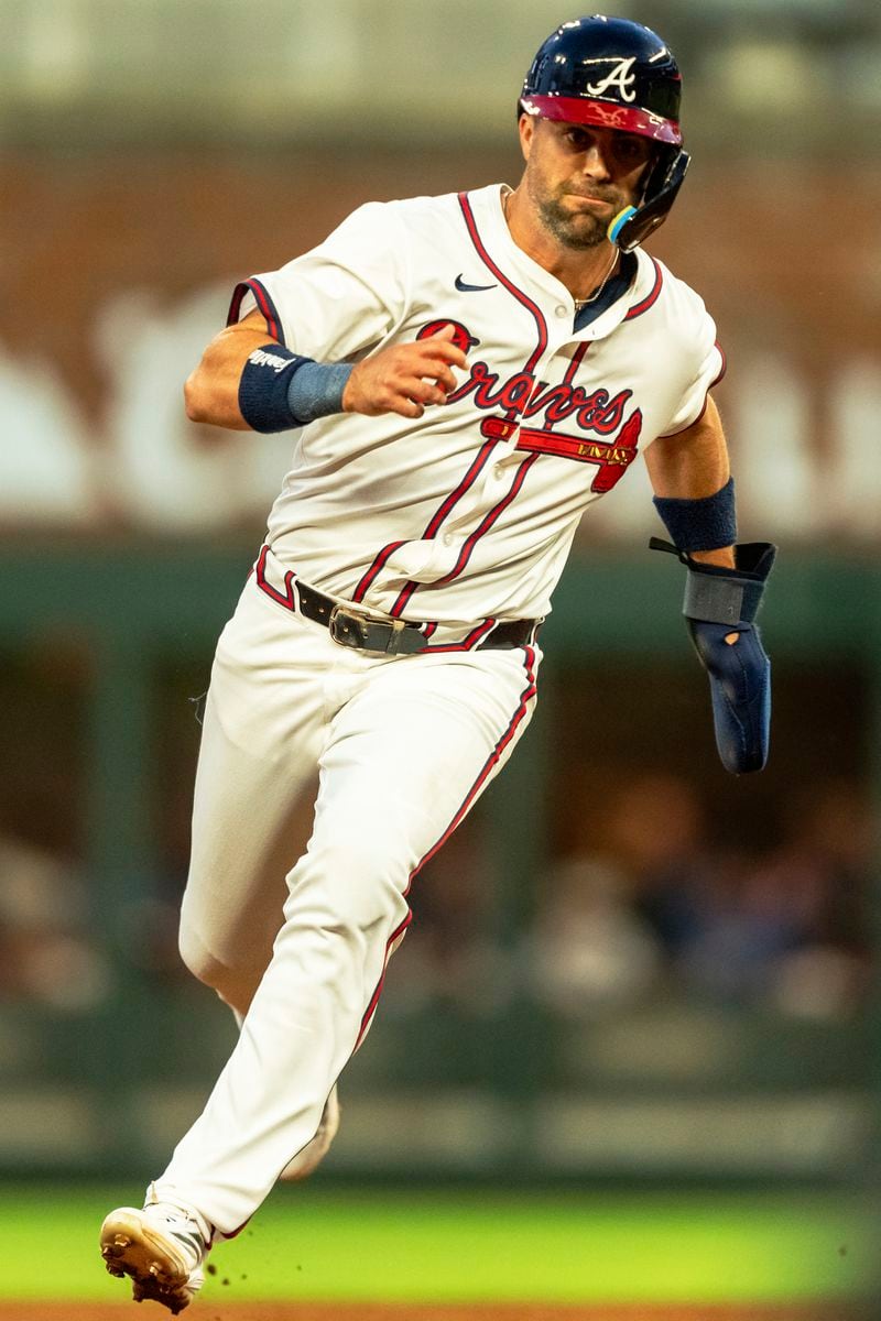 Atlanta Braves' Whit Merrifield rounds second base after a hit by Gio Urshel in the third inning of a baseball game against the Colorado Rockies, Tuesday, Sep. 3, 2024, in Atlanta. (AP Photo/Jason Allen)