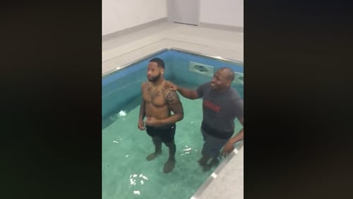 Dallas Cowboys team chaplain Jonathan Evans baptized three players at the team facility on Tuesday, Dec.5, 2017.