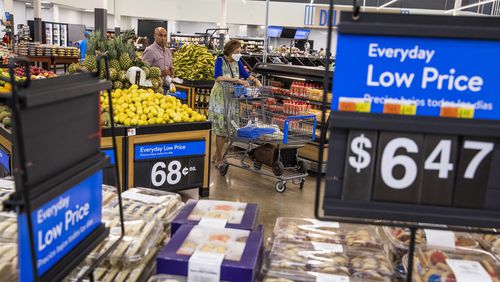 FILE - People buy groceries at a Walmart Superstore in Secaucus, New Jersey, July 11, 2024. (AP Photo/Eduardo Munoz Alvarez)