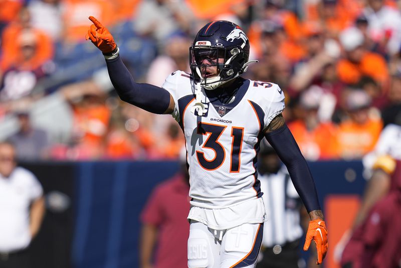 Denver Broncos safety Justin Simmons (31) lines up against the Washington Commanders during an NFL football game Sunday, Sept. 10, 2023, in Denver. (AP Photo/Jack Dempsey)