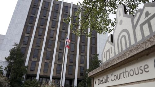 The DeKalb Courthouse is among four government buildings where weapons are not permitted inside. The county is increasing the use of armed guards at other county facilities because state law permit citizens to carry their guns inside.