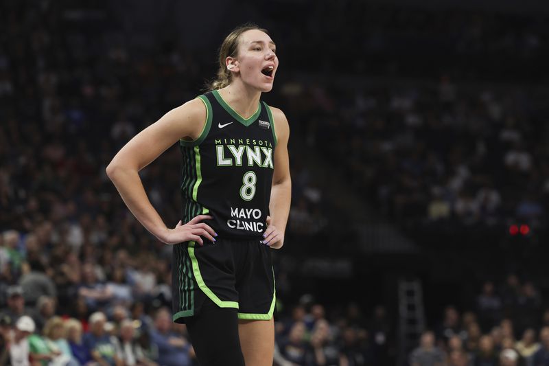 Minnesota Lynx forward Alanna Smith (8) calls out to her team during the second half of Game 1 of a WNBA basketball semifinals series against the Connecticut Sun, Sunday, Sept. 29, 2024, in Minneapolis. (AP Photo/Stacy Bengs)