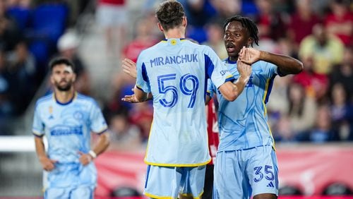 Atlanta United midfielder Alexey Miranchuk #59 celebrates with teammates after a goal during the first half of the match against the New York Red Bulls at Red Bull Arena in Harrison, NJ on Saturday September 21, 2024. (Photo by Mitch Martin/Atlanta United)