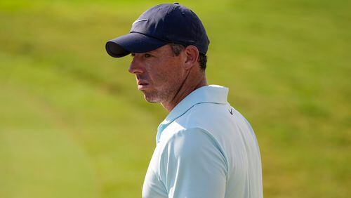 Rory McIlroy, of Northern Ireland, walks on the 18th green during the first round of the Tour Championship golf tournament, Thursday, Aug. 29, 2024, in Atlanta. (AP Photo/Mike Stewart)