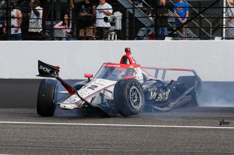 The damaged car driven by Will Power, of Australia, slides after hitting the wall in the first turn during the Indianapolis 500 auto race at Indianapolis Motor Speedway in Indianapolis, Sunday, May 26, 2024. (AP Photo/Kirk DeBrunner)