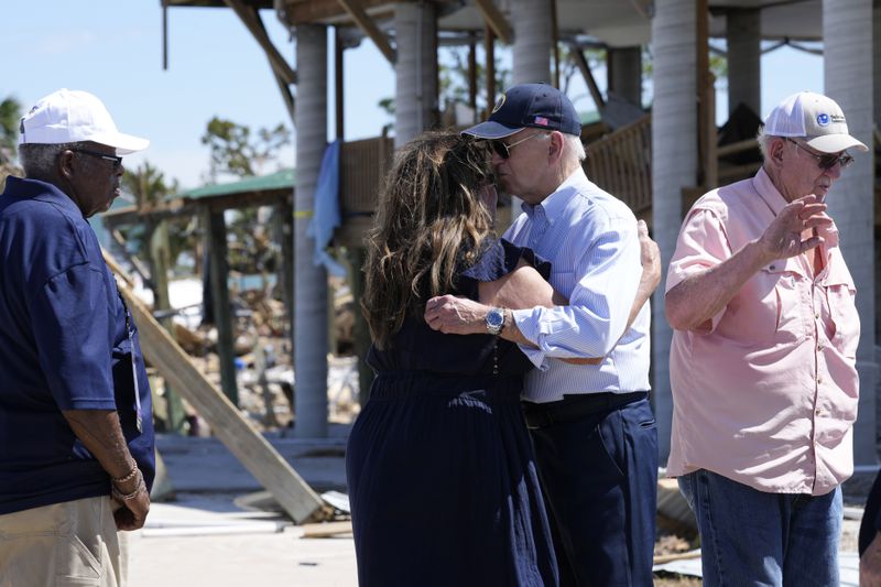 President Joe Biden greets people in Keaton Beach, Fla., Thursday, Oct. 3, 2024, during his tour of areas impacted by Hurricane Helene. (AP Photo/Susan Walsh)