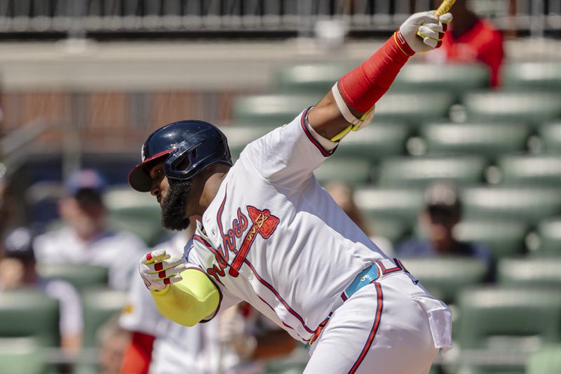 Atlanta Braves' Marcell Ozuna swings at a pitch called strike in the third inning of a baseball game between the Washington Nationals and the Atlanta Braves, Sunday, Aug. 25, 2024, in Atlanta. (AP Photo/Jason Allen)