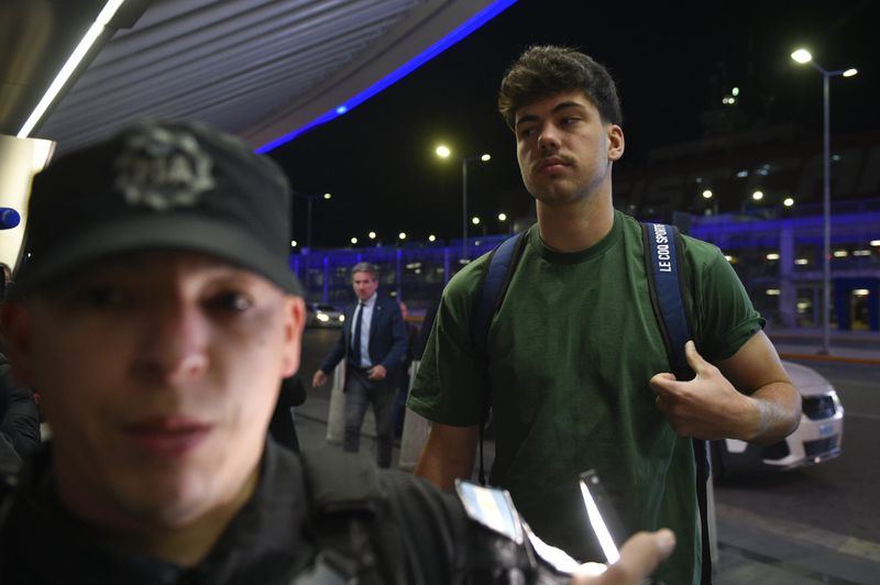 French rugby player Hugo Auradou arrives at Ezeiza International Airport in Buenos Aires, Argentina, Tuesday, Sept. 3, 2024. Argentine prosecutors decided to let Auradou and teammate Oscar Jegou leave the country despite the players remaining under investigation for alleged rape. (AP Photo/Gustavo Garello)