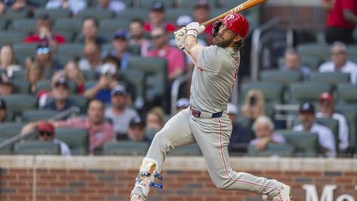 Philadelphia Phillies' Bryce Harper hits a foul ball in the first inning of a baseball game against the Atlanta Braves, Wednesday, Aug. 21, 2024, in Atlanta. (AP Photo/Jason Allen)