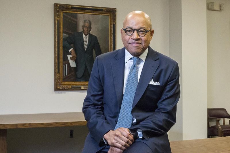 David A. Thomas, the 12th president of Morehouse College, is one of two presidents at the college who did not have ties to a historically black college or university before taking the role as president. The other president, Benjamin Mays, is displayed in an oil painting in the background. ALYSSA POINTER / ALYSSA.POINTER@AJC.COM