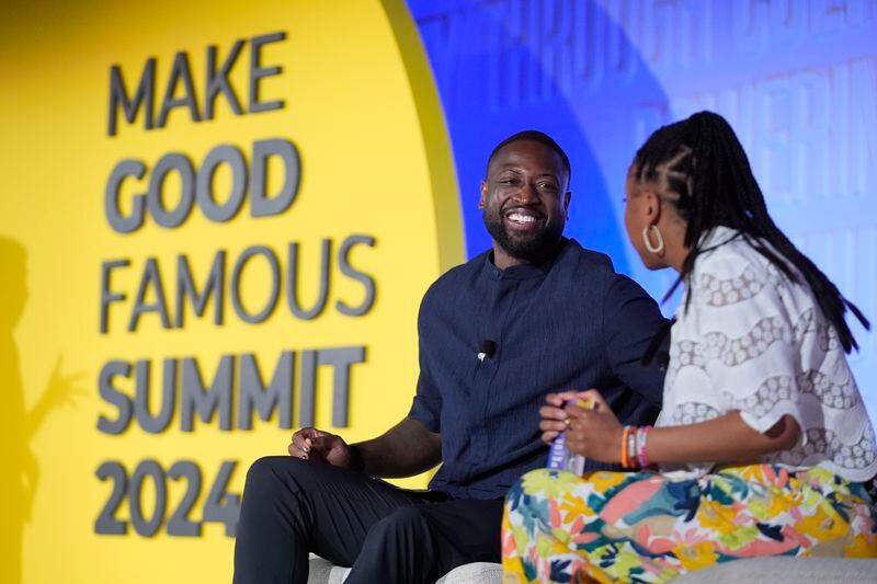 NBA Hall of Famer Dwyane Wade, left, speaks with Phoebe Robinson after he received the Elevate Prize Catalyst Award, Thursday, May 23, 2024, at the Make Good Famous Summit in Miami Beach, Fla. Wade has launched Translatable, a nonprofit online community dedicated to supporting transgender youth. (AP Photo/Wilfredo Lee)