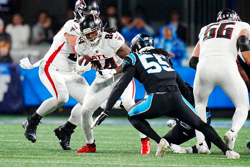 Atlanta Falcons running back Cordarrelle Patterson is tackled by Carolina Panthers linebacker Cory Littleton during the first half of an NFL football game on Thursday, Nov. 10, 2022, in Charlotte, N.C. (AP Photo/Rusty Jones)