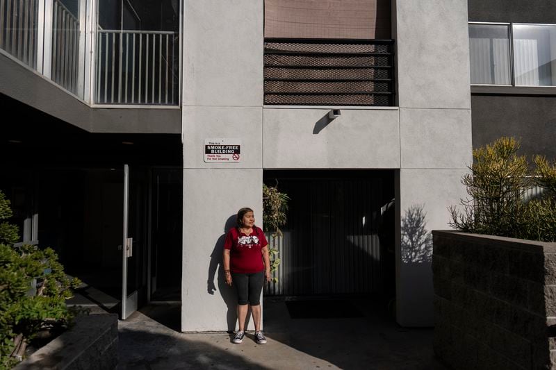 Marina Maalouf, a longtime resident of Hillside Villa who participated in protests after rents doubled in 2019, stands for a photo inside her apartment building in Los Angeles on Wednesday, Sept. 18, 2024. (AP Photo/Jae C. Hong)