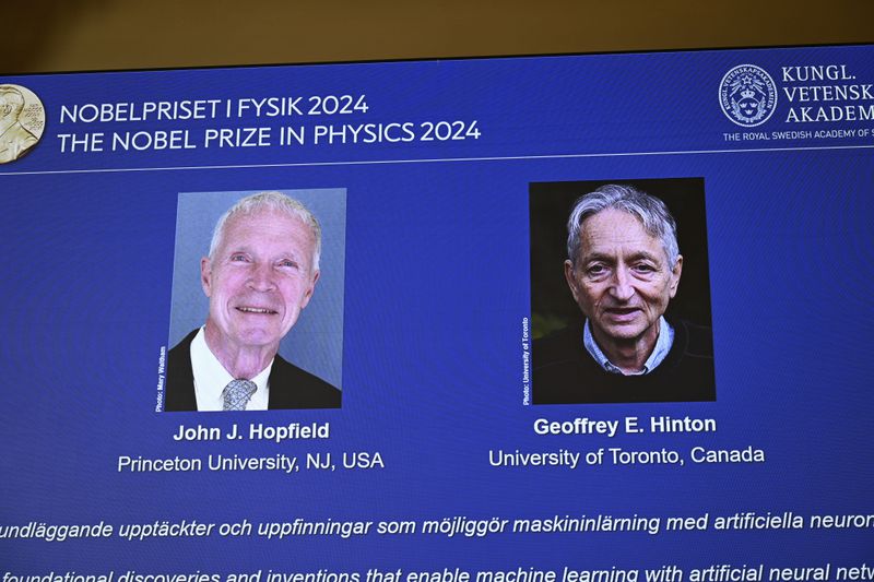 John Hopfield and Geoffrey Hinton, seen in picture, are awarded the 2024 Nobel Prize in Physics, announced at a press conference at the Royal Swedish Academy of Sciences in Stockholm, Sweden Tuesday Oct. 8, 2024. (Christine Olsson/TT News Agency via AP)