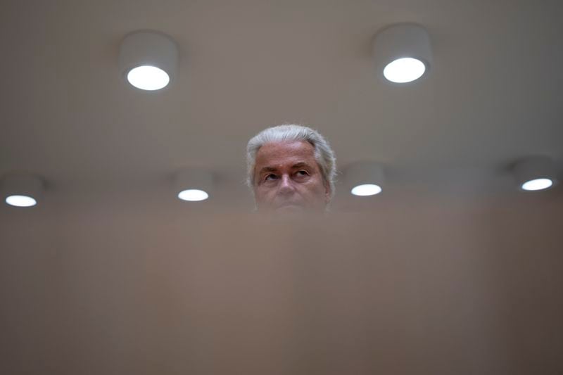 Anti-Islam lawmaker Geert Wilders takes his seat at the high security court at Schiphol, near Amsterdam, Netherlands, Monday, Sept. 9, 2024, to hear the verdict against two Pakistani men on charges of threatening Wilders. (AP Photo/Peter Dejong)