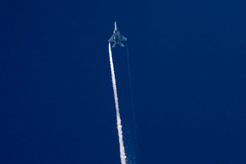 An armed Israeli fighter jet is seen from Hadera as it crosses towards northern Israel, on Monday, Sept. 23, 2024. (AP Photo/Ariel Schalit)