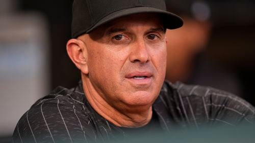 Chicago White Sox manager Pedro Grifol stands in the dugout before a baseball game against the Kansas City Royals, Monday, July 29, 2024, in Chicago. (AP Photo/Erin Hooley)