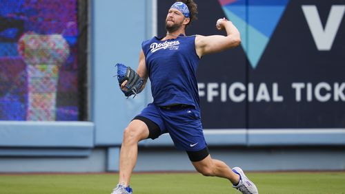 FILE - Los Angeles Dodgers' Clayton Kershaw works out before a baseball game against the Colorado Rockies in Los Angeles, Sunday, June 2, 2024. Los Angeles Dodgers left-hander Kershaw made a second rehab start in his bid to return from offseason left shoulder surgery, pitching four innings for Triple-A Oklahoma City against Round Rock.(AP Photo/Ashley Landis, File)