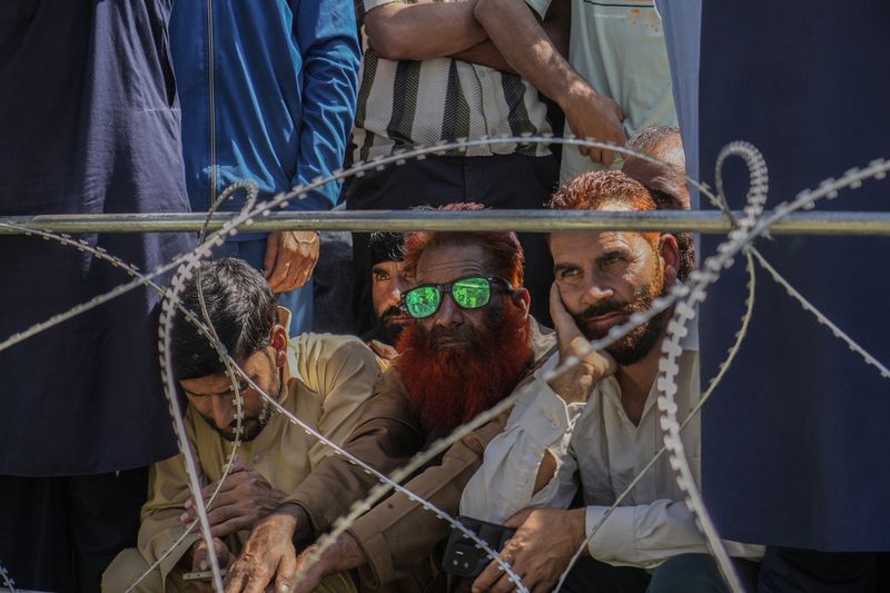 Supporters of Awami Ittehad Party (AIP) leader Sheikh Abdul Rashid, also known as Engineer Rashid, attend a public rally at Baramulla, some 55 kilometers (34 miles) north of Srinagar, Indian controlled Kashmir, Sept. 12, 2024. (AP Photo/Mukhtar Khan, File)