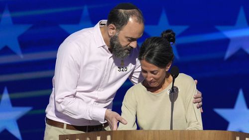 Jon Polin, left, and Rachel Goldberg, parents of Hersh Goldberg-Polin, speak on stage during the Democratic National Convention Wednesday, Aug. 21, 2024, in Chicago. (AP Photo/J. Scott Applewhite)