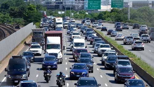 FILE - Vehicles move slowly in south-bound lanes, left, of Interstate Route 93, in Boston, on July 3, 2024. (AP Photo/Steven Senne, File)