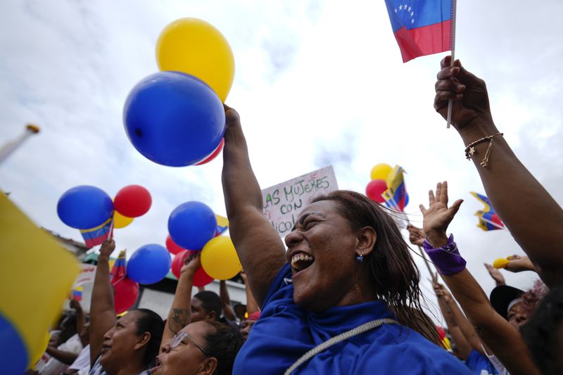 FILE - Supporters cheer during a campaign rally for President Nicolas Maduro, who is seeking a third term, in Guatire, Venezuela, Friday, May 31, 2024. No decision in Venezuela over the past 25 years has been as consequential as the choice voters will make on July 28. (AP Photo/Ariana Cubillos, File)