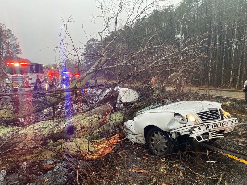 One person was killed when a massive tree fell on their vehicle while driving along Fayetteville Road in Clayton County amid strong storms Tuesday morning, according to police.