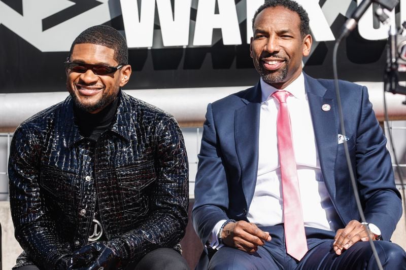 Usher with Atlanta Mayor Andre Dickens on Feb. 14, 2024 at a ceremony where the R&B singer received the city's highest honor The Phoenix Award.on Wednesday, Feb. 14, 2024. (Natrice Miller/ Natrice.miller@ajc.com)