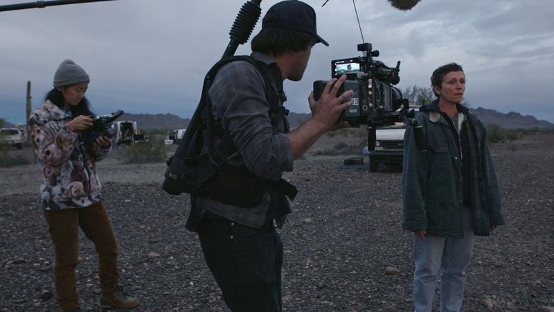From left, director/writer Chloe Zhao, director of photography Joshua James Richards and Frances McDormand on the set of "Nomadland." (Searchlight Pictures/2020 20th Century Studios)